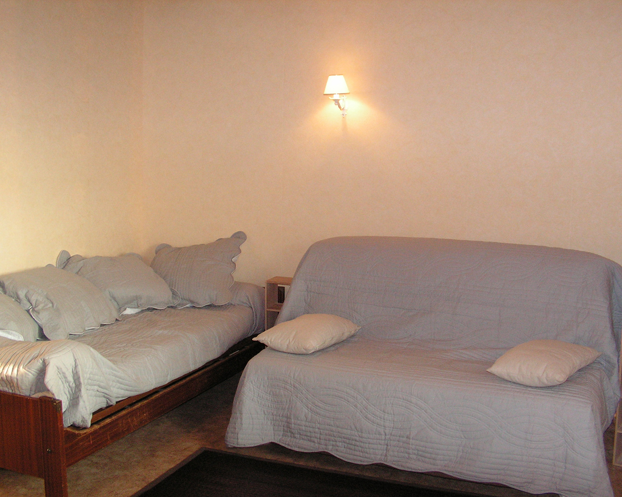 Salon avec canapé lit Domaine des Crêtes